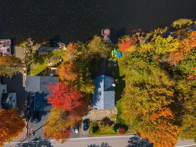 an overhead view of a house with trees and water at Water Front Dream Hot Tub Fire Pit King Bed in Tobyhanna