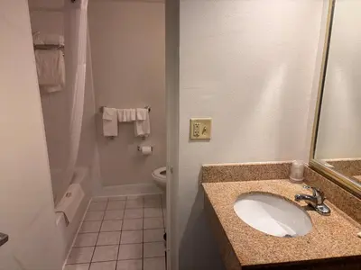 a bathroom with a sink and a toilet at Hamden Hotel and Suites HAMDEN - NEW HAVEN in Hamden