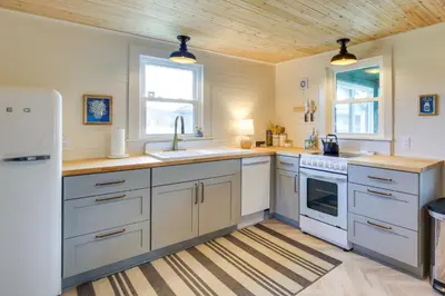 a kitchen with white appliances and a wooden ceiling at 4 Mi to Great Barrington Berkshires Retreat! in Sheffield