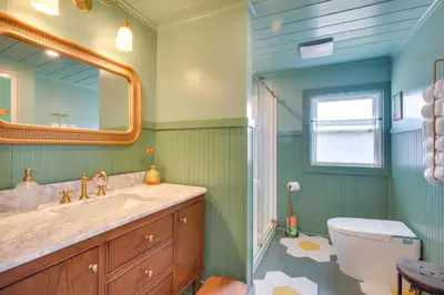 a bathroom with a sink and a mirror at 4 Mi to Great Barrington Berkshires Retreat! in Sheffield
