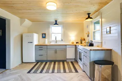 a kitchen with a refrigerator and a sink at 4 Mi to Great Barrington Berkshires Retreat! in Sheffield