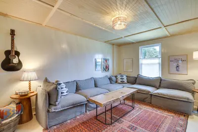 a living room with a couch and a table at 4 Mi to Great Barrington Berkshires Retreat! in Sheffield