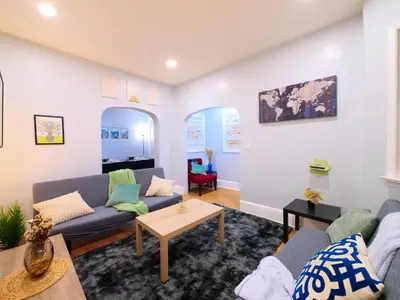 a living room with a couch and a table at NYC Views & Comfort - Modern 2-Bedroom Apartment in Jersey City