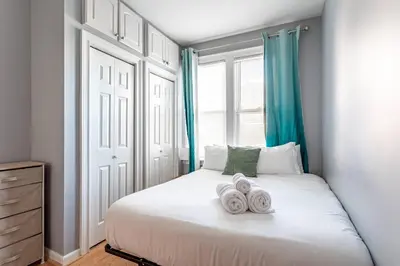 a bedroom with a bed with two towels on it at City Outside Serenity Inside: 2B1B NYC - 40 Min in Jersey City