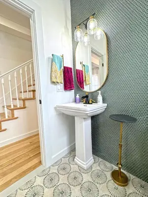 a bathroom with a sink and a mirror at Renovated home seconds from town in Woodstock