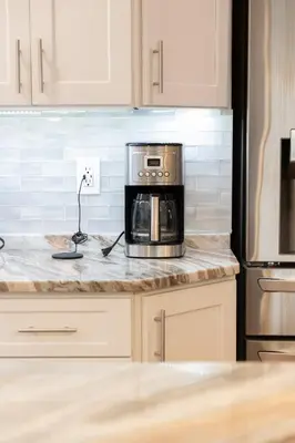 a kitchen with a counter top with a microwave at R&C Getaway in Greenville