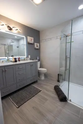 a bathroom with a toilet and a sink and a shower at R&C Getaway in Greenville