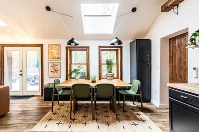 a kitchen with a dining room table and chairs at Stunning Catskills Cabin in Margaretville