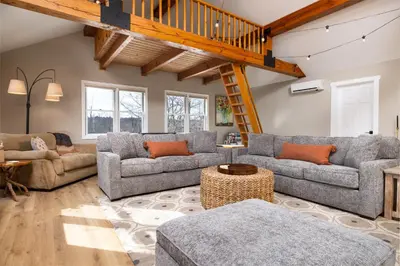 a living room with couches and a loft at Lakefront Luxury at Stony Pointe in Ballston Spa