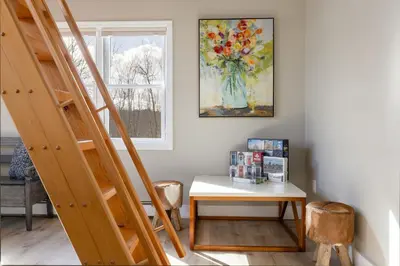 a room with a table and a painting on the wall at Lakefront Luxury at Stony Pointe in Ballston Spa