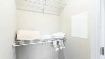 a towel rack in a bathroom with towels at Modern Apartment In Harbor Point in South End