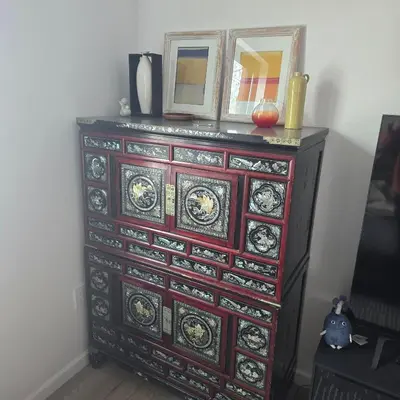 a dresser with a mirror on top of it at Astoria, steps away from Manhattan in Astoria