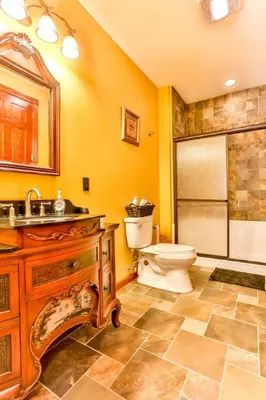 a bathroom with a toilet and a sink and a shower at Catskills retreat - ATV, Hot tub, hiking, fishing in Cairo