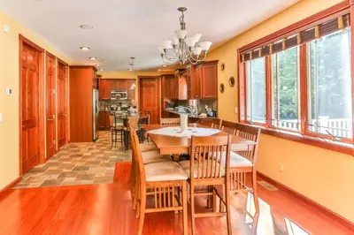 a dining room and kitchen with a table and chairs at Catskills retreat - ATV, Hot tub, hiking, fishing in Cairo