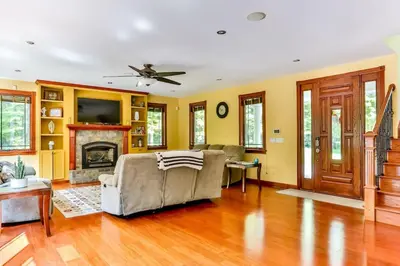 a living room with a couch and a fireplace at Catskills retreat - ATV, Hot tub, hiking, fishing in Cairo