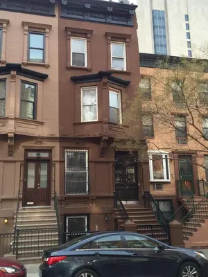 a black car parked in front of a building at The Parlor in New York