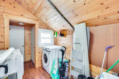 a tiny house with a washer and dryer in a room at 7 Mi to Belleayre Ski Mountain Getaway with Porch in Fleischmanns
