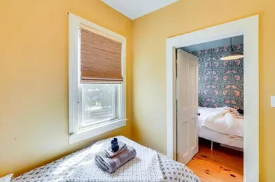 a small bedroom with a bed and a window at 7 Mi to Belleayre Ski Mountain Getaway with Porch in Fleischmanns