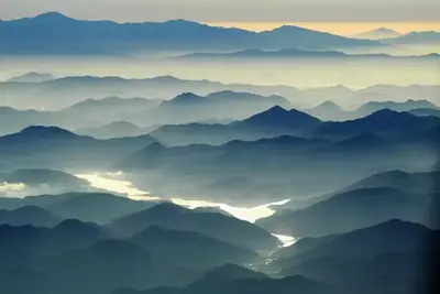 a view of a mountain range with fog in the foreground at Windham Ridge Chalet in Windham