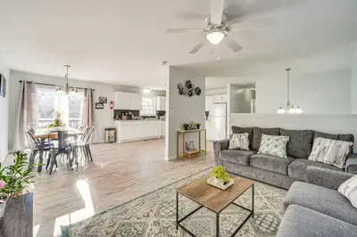 a living room with a couch and a table at Newly renovated home, Fire pit, Games, Grill in Tobyhanna