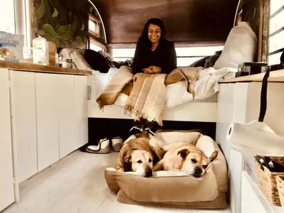 two dogs laying in beds in a room at Romantic Glamping Getaway in a Pet Friendly Caravan, Ideal to Explore Hudson Valley in New Forge