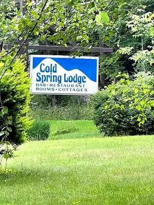 a sign for a cold spring lodge in a yard at Homey Pet-Friendly Cabin Rental for Groups in the Catskills in Big Indian