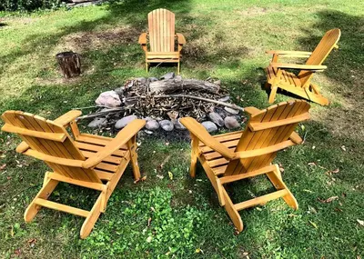 a group of chairs sitting around a fire pit at Simple Cabin Camping for Families in the Catskills of Upstate New York in Big Indian