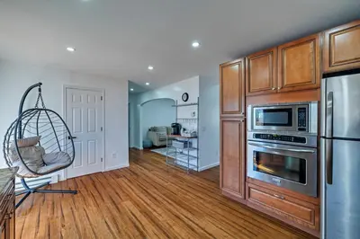 a living room with a kitchen with a refrigerator at Home in Bushkill Saw Creek Poconos area in Saw Creek