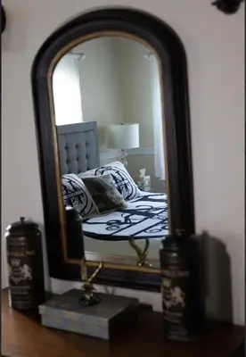 a bedroom with a bed and a mirror at Luxury Estate Elegant Private The White Lion Manor in Middletown