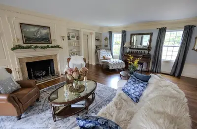 a living room with a couch and a fireplace at Luxury Estate Elegant Private The White Lion Manor in Middletown