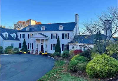 a large white house with a driveway at Luxury Estate Elegant Private The White Lion Manor in Middletown