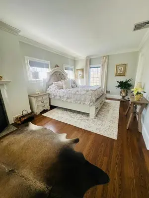 a bedroom with a large bed and a wooden floor at Luxury Estate Elegant Private The White Lion Manor in Middletown