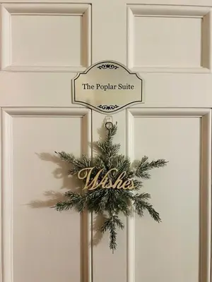 a door with a christmas wreath on it at Luxury Estate Elegant Private The White Lion Manor in Middletown