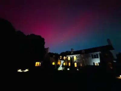 a night view of a house with lights in the dark at Luxury Estate Elegant Private The White Lion Manor in Middletown