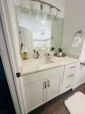 a bathroom with a sink and a large mirror at Connecticut Waterfront Home, With Hot Tub, Cozy in Rocky Hill