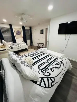 a bedroom with two beds and a flat screen tv at Connecticut Waterfront Home, With Hot Tub, Cozy in Rocky Hill