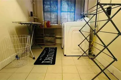 a kitchen with a white refrigerator and a black welcome mat at Luxury Estate Elegant Private The White Lion Manor in Middletown