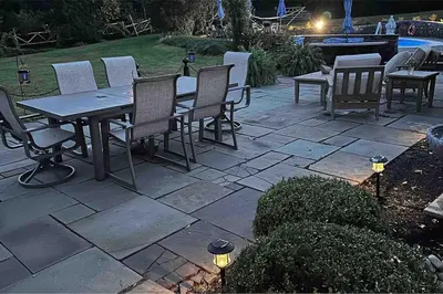 a patio with a table and chairs and a pool at Luxury Estate Elegant Private The White Lion Manor in Middletown