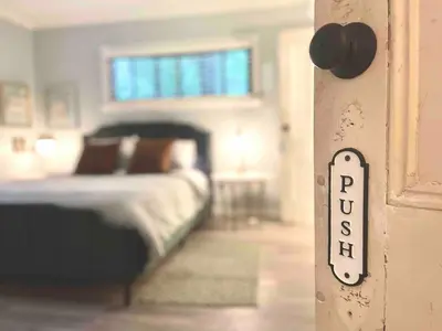 a bedroom with a bed with a sign that says pendulum at Romantic Chalet Hot Tub Near Hunter Mountain in Tannersville