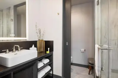 a bathroom with a sink and a mirror at The Vibe on 5th XIII Vibe 8762 in New York