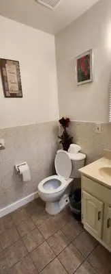 a bathroom with a toilet and a sink at Gold queen 4A in Newark