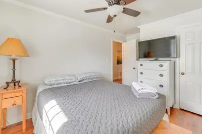 a bedroom with a bed and a ceiling fan at Historic Manor 3 Mi to Shawnee Mtn! Pet Friendly in East Stroudsburg