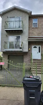 a house with a trash can in front of it at Beautiful Room king in Newark