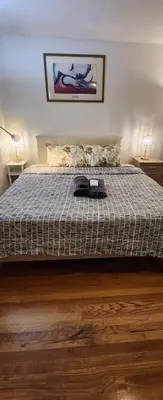 a bedroom with a bed with a blanket on it at Lemon king room 4 in Newark