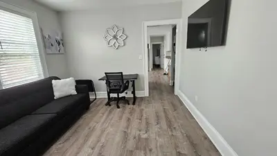 a living room with a couch and a table at Room for rent shared apartment in Hartford
