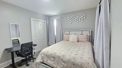 a bedroom with a bed and a desk and a desk at Room for rent shared apartment in Hartford