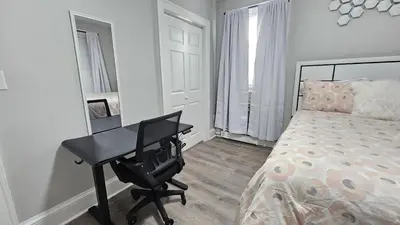 a bedroom with a desk and a bed with a bed gmaxwell gmaxwell gmaxwell at Room for rent shared apartment in Hartford