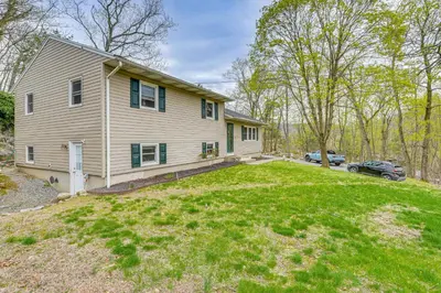 a house with a car parked in a yard at Home 2 Mi to Thayer Gate at U S Military Academy in Highland Falls