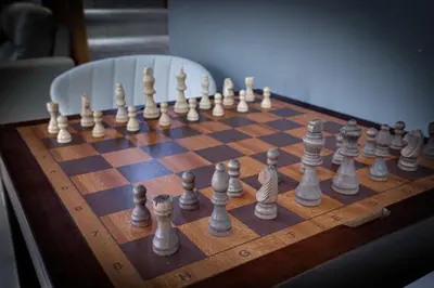 a wooden chess board with chess pieces on it at 3BR Home w Outdoor Fun Lake Fire Pit Games Grill in Tobyhanna
