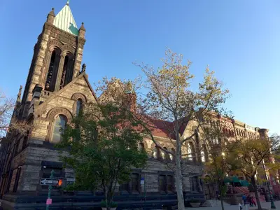a large church with a tower on a street at Top Rated 1BR - Lenox 127 in New York